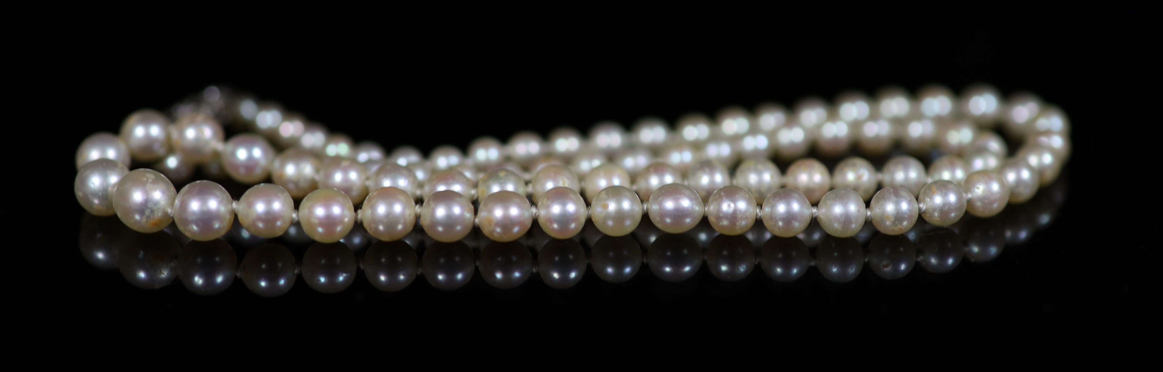 An early 20th century graduated pearl necklace, with platinum and millegrain set diamond clasp